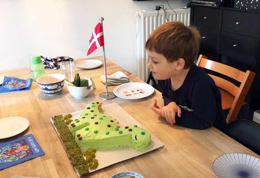 A little boy and his DINOSAUR Birthday Cake